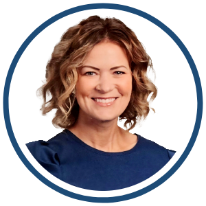 Megan Allen, a smiling woman with short, wavy, light brown hair wearing a navy blue top, pictured inside a blue circular frame on a white background.